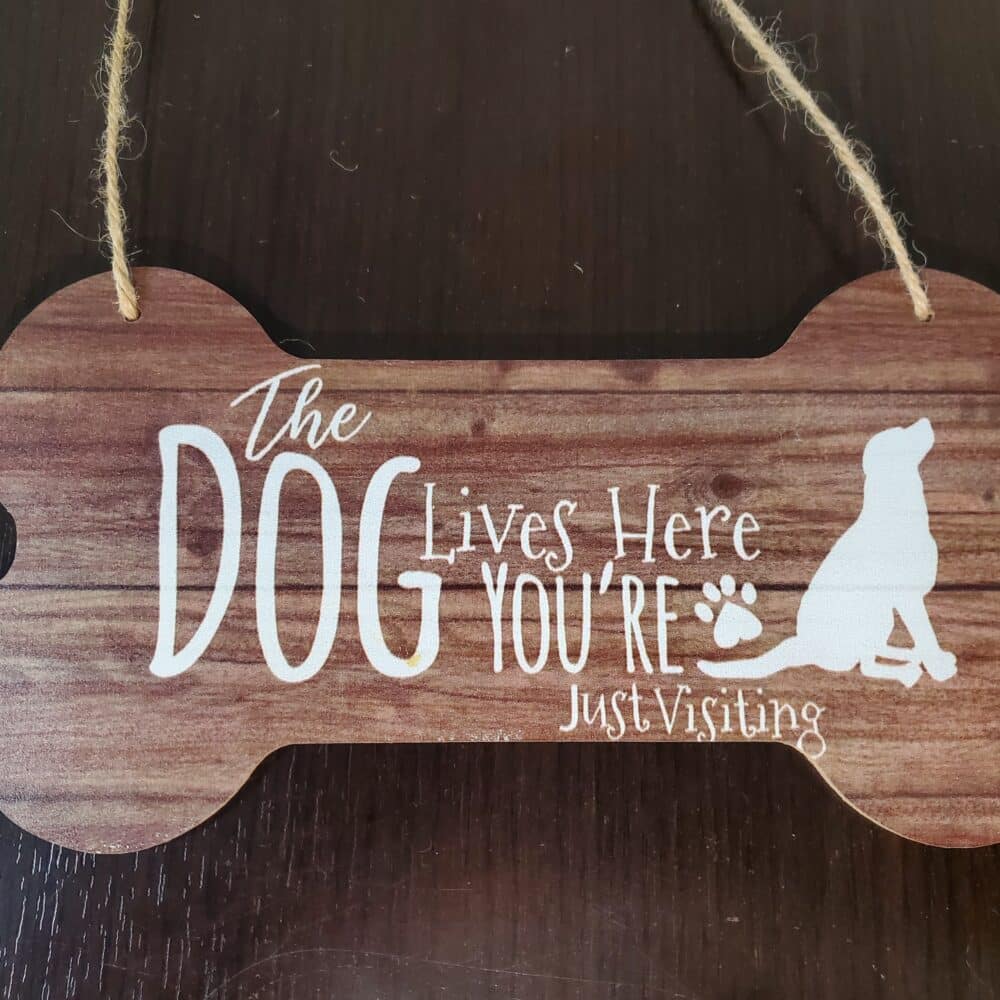 The Dog Lives Here You're Just Visiting Door Sign