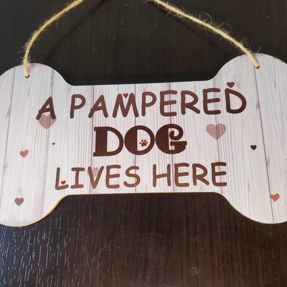 A Pampered Dog Lives Here Sign