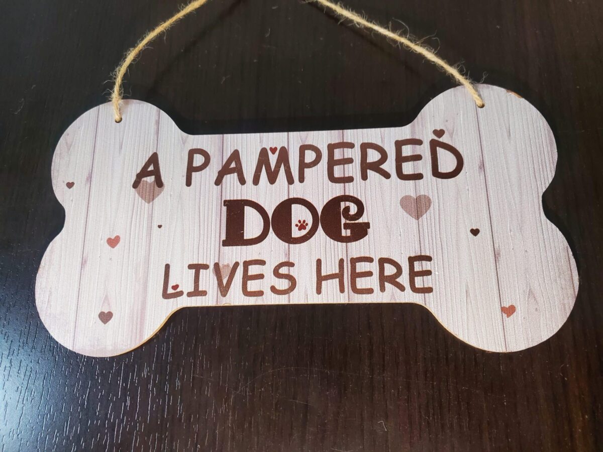 A Pampered Dog Lives Here Sign